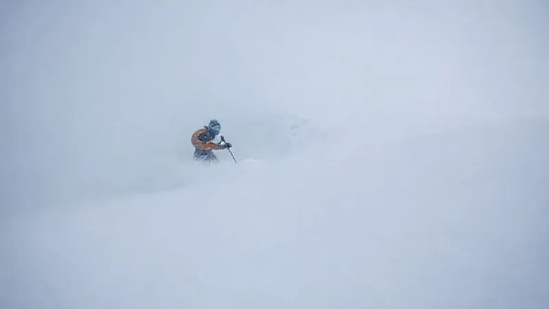 A backcountry skier in a dense whiteout, using a ski pole to probe the snow ahead, revealing a subtle drop-off or gully edge obscured by the flat light. The scene emphasizes extreme caution and the unseen dangers. Photorealistic, professional photography, 8K, cinematic lighting, sharp focus on the skier's pole and the snow, depth of field blurring the featureless background, shot on a high-end DSLR. A backcountry skier in a dense whiteout, using a ski pole to probe the snow ahead, revealing a subtle drop-off or gully edge obscured by the flat light. The scene emphasizes extreme caution and the unseen dangers. Photorealistic, professional photography, 8K, cinematic lighting, sharp focus on the skier's pole and the snow, depth of field blurring the featureless background, shot on a high-end DSLR.