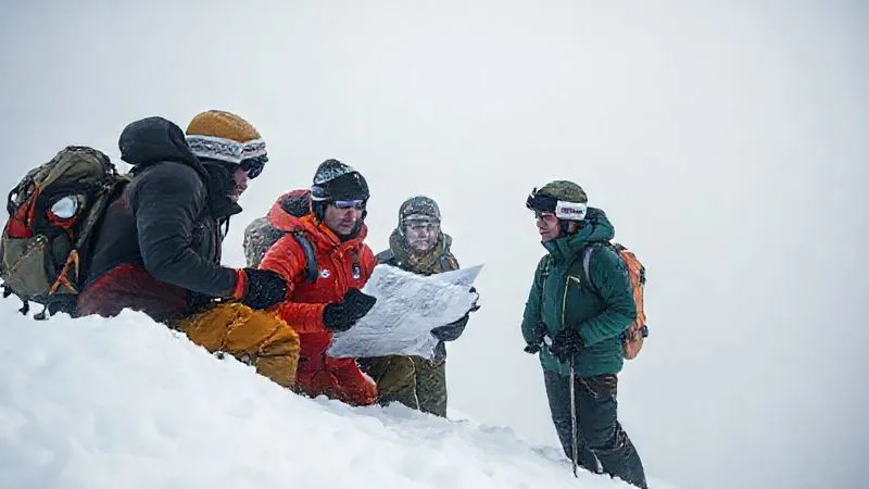 A small group of backcountry skiers huddled together on a relatively flat, snow-covered ridge in a dense whiteout, discussing a map and GPS device. Their faces show concern but also determination, illustrating a critical decision-making moment under difficult conditions. Photorealistic, professional photography, 8K, cinematic lighting, sharp focus on the group and their gear, depth of field blurring the featureless background, shot on a high-end DSLR. A small group of backcountry skiers huddled together on a relatively flat, snow-covered ridge in a dense whiteout, discussing a map and GPS device. Their faces show concern but also determination, illustrating a critical decision-making moment under difficult conditions. Photorealistic, professional photography, 8K, cinematic lighting, sharp focus on the group and their gear, depth of field blurring the featureless background, shot on a high-end DSLR.