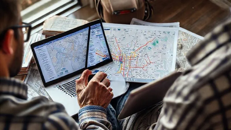 photorealistic, professional photography, 8K, cinematic lighting, sharp focus, depth of field, shot on a high-end DSLR. A traveler meticulously planning their city break on a laptop and tablet, surrounded by guidebooks and printed maps, with a cup of coffee. The screen shows a detailed public transport network map with highlighted routes, conveying a sense of organized preparation and foresight. photorealistic, professional photography, 8K, cinematic lighting, sharp focus, depth of field, shot on a high-end DSLR. A traveler meticulously planning their city break on a laptop and tablet, surrounded by guidebooks and printed maps, with a cup of coffee. The screen shows a detailed public transport network map with highlighted routes, conveying a sense of organized preparation and foresight.
