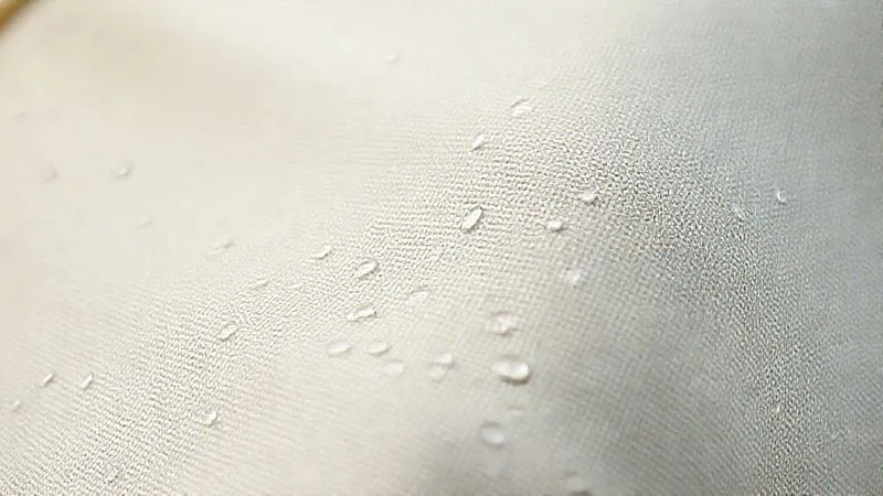 photorealistic, professional photography, 8K, cinematic lighting, sharp focus, depth of field, shot on a high-end DSLR, a close-up, macro shot of a durable, thick polycotton canvas tent fabric with visible ripstop weave, showing water beads on its surface, emphasizing its weather-resistant quality. photorealistic, professional photography, 8K, cinematic lighting, sharp focus, depth of field, shot on a high-end DSLR, a close-up, macro shot of a durable, thick polycotton canvas tent fabric with visible ripstop weave, showing water beads on its surface, emphasizing its weather-resistant quality.