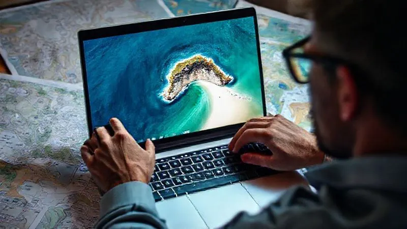 A person intently focused on a laptop screen, surrounded by maps and travel guides, deep diving into online forums and satellite imagery to uncover a hidden beach. The screen shows a detailed satellite view of a coastline with a tiny, isolated cove. Photorealistic, professional photography, 8K, cinematic lighting, sharp focus, depth of field, shot on a high-end DSLR. A person intently focused on a laptop screen, surrounded by maps and travel guides, deep diving into online forums and satellite imagery to uncover a hidden beach. The screen shows a detailed satellite view of a coastline with a tiny, isolated cove. Photorealistic, professional photography, 8K, cinematic lighting, sharp focus, depth of field, shot on a high-end DSLR.