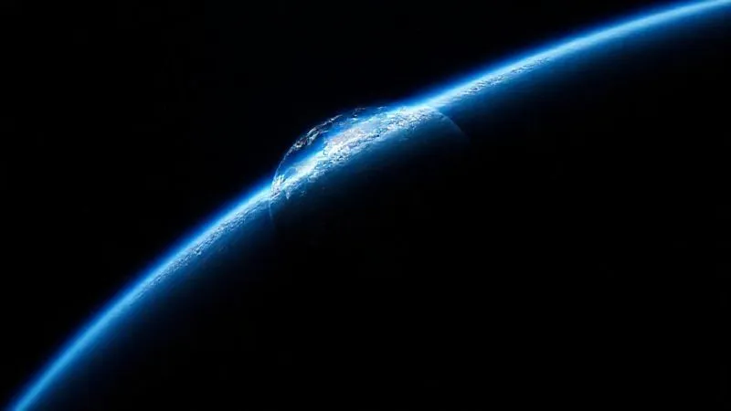 A photorealistic image from space, showing the Earth's curvature with a thin blue atmospheric layer against the blackness of space. The scene is incredibly vibrant and awe-inspiring, with a sense of fragility and wonder. Cinematic lighting emphasizes the Earth's beauty and isolation. Sharp focus on the Earth, with a gentle depth of field blurring the distant stars. 8K hyper-detailed. A photorealistic image from space, showing the Earth's curvature with a thin blue atmospheric layer against the blackness of space. The scene is incredibly vibrant and awe-inspiring, with a sense of fragility and wonder. Cinematic lighting emphasizes the Earth's beauty and isolation. Sharp focus on the Earth, with a gentle depth of field blurring the distant stars. 8K hyper-detailed.