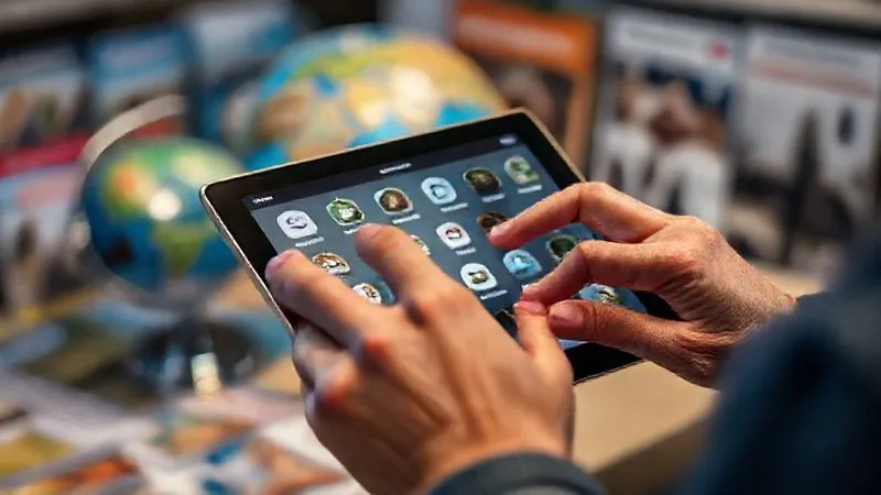 A photorealistic image of a person's hands meticulously scrolling through accessibility features on a tablet, with a blurred background of various travel brochures and a globe, cinematic lighting, sharp focus on the tablet screen showing detailed accessibility icons, 8K hyper-detailed, professional photography, shot on a high-end DSLR. A photorealistic image of a person's hands meticulously scrolling through accessibility features on a tablet, with a blurred background of various travel brochures and a globe, cinematic lighting, sharp focus on the tablet screen showing detailed accessibility icons, 8K hyper-detailed, professional photography, shot on a high-end DSLR.