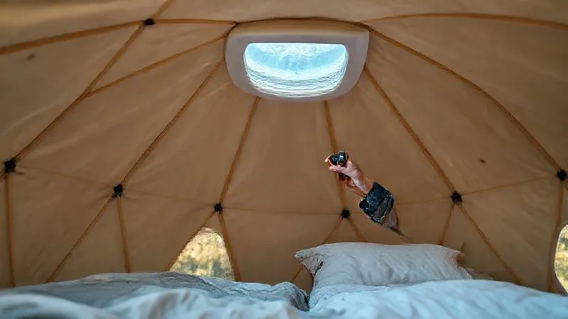 A photorealistic image of a glamping geodome interior, meticulously clean and well-maintained, with a staff member conducting a routine inspection, checking a vent for airflow with a small anemometer. The lighting is bright and inviting, emphasizing cleanliness. professional photography, 8K, cinematic lighting, sharp focus, depth of field, shot on a high-end DSLR A photorealistic image of a glamping geodome interior, meticulously clean and well-maintained, with a staff member conducting a routine inspection, checking a vent for airflow with a small anemometer. The lighting is bright and inviting, emphasizing cleanliness. professional photography, 8K, cinematic lighting, sharp focus, depth of field, shot on a high-end DSLR