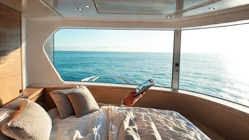 photorealistic, professional photography, 8K, cinematic lighting, sharp focus, depth of field, shot on a high-end DSLR of a sophisticated business person in a luxurious, minimalist yacht cabin, looking out at a pristine, secluded ocean view, with a sense of calm and exclusivity. The person is discreetly holding a tablet, planning an itinerary. photorealistic, professional photography, 8K, cinematic lighting, sharp focus, depth of field, shot on a high-end DSLR of a sophisticated business person in a luxurious, minimalist yacht cabin, looking out at a pristine, secluded ocean view, with a sense of calm and exclusivity. The person is discreetly holding a tablet, planning an itinerary.