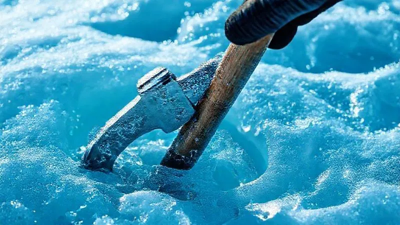 A close-up, photorealistic shot of an ice axe firmly planted in shimmering blue ice, showing intricate ice crystal details, with a gloved hand gripping the shaft, cinematic lighting, sharp focus, 8K hyper-detailed. A close-up, photorealistic shot of an ice axe firmly planted in shimmering blue ice, showing intricate ice crystal details, with a gloved hand gripping the shaft, cinematic lighting, sharp focus, 8K hyper-detailed.